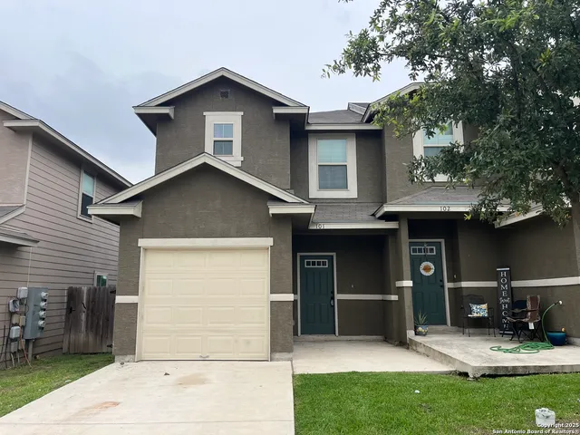 a front view of a house with yard