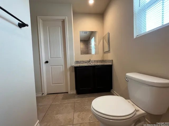 a bathroom with a toilet and a sink