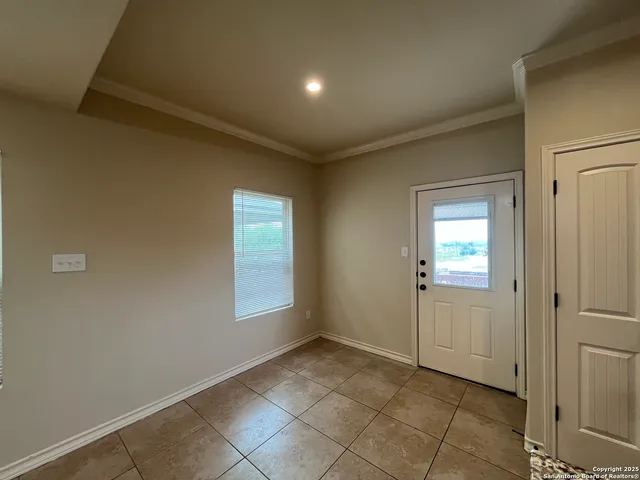 a view of an empty room and window