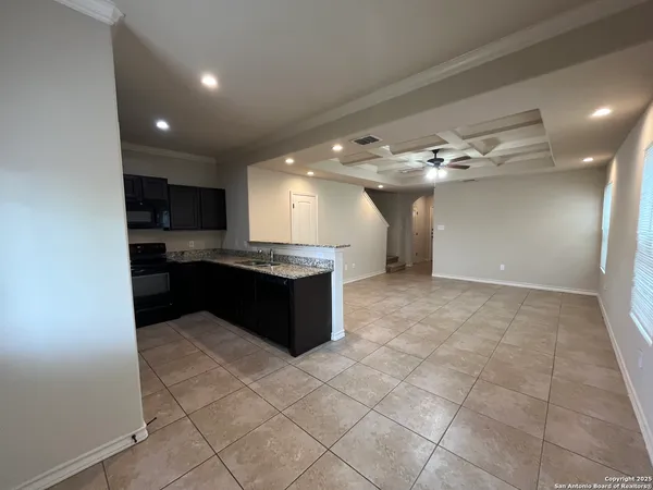 a large bathroom with a large tub and sink