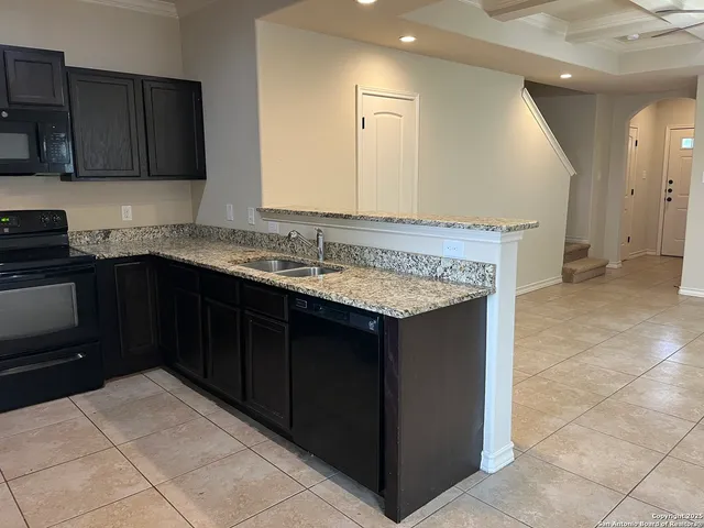 a kitchen with a sink and a cabinets