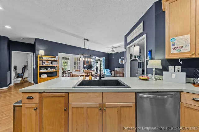 a kitchen with sink and refrigerator