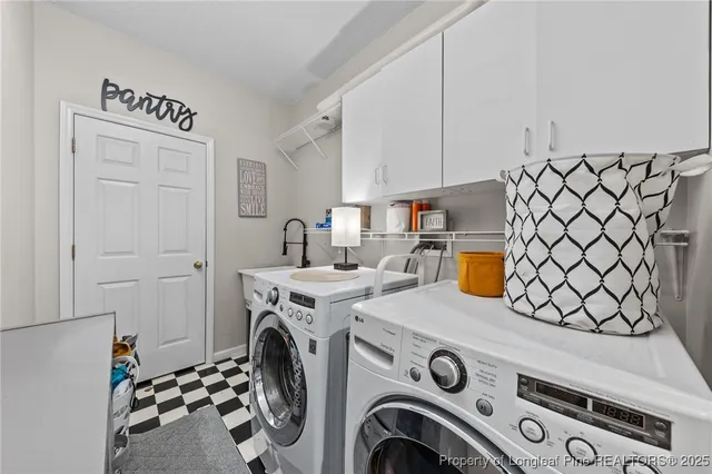 a view of storage and utility room with washer and dryer