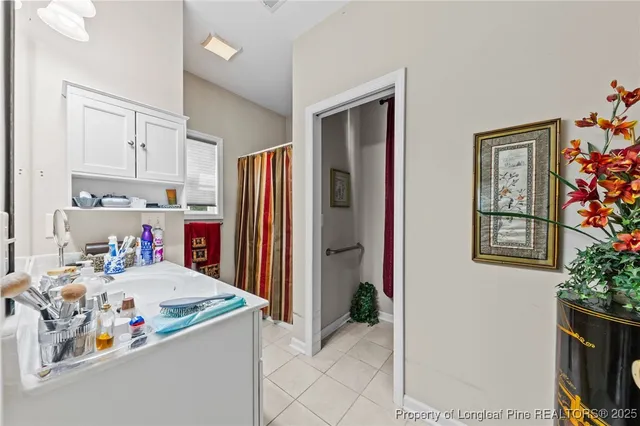 a kitchen with granite countertop a refrigerator and a stove top oven
