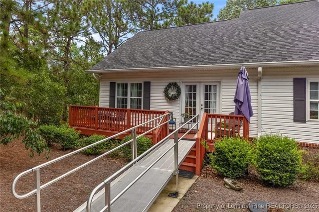 a view of a house with a small deck
