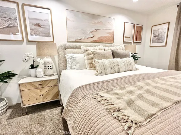 a living room with furniture and flowers