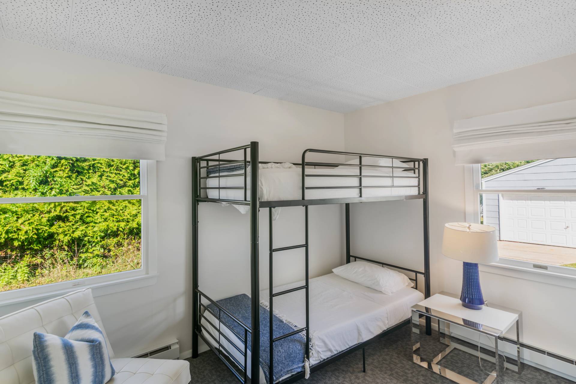 19 Deforest Road Montauk, NY 11954 - Photo 14 of 20 a bedroom with a bed and a window