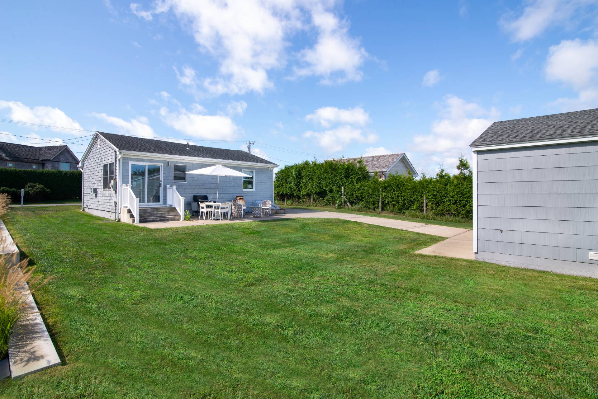 19 Deforest Road Montauk, NY 11954 - Photo 7 of 20 a view of a house with a yard and sitting area