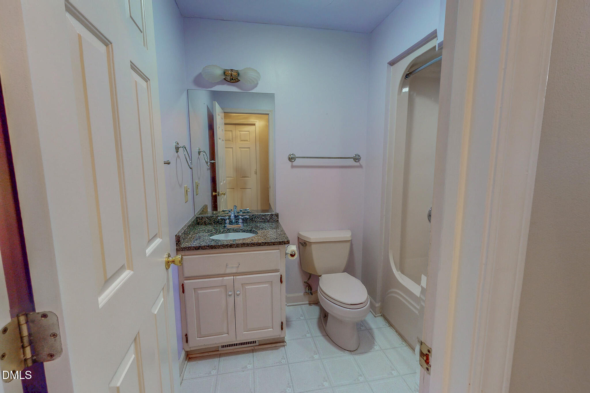 11 Denada Path Roxboro, NC 27574 - Photo 38 of 62 a bathroom with a granite countertop toilet a sink and a mirror