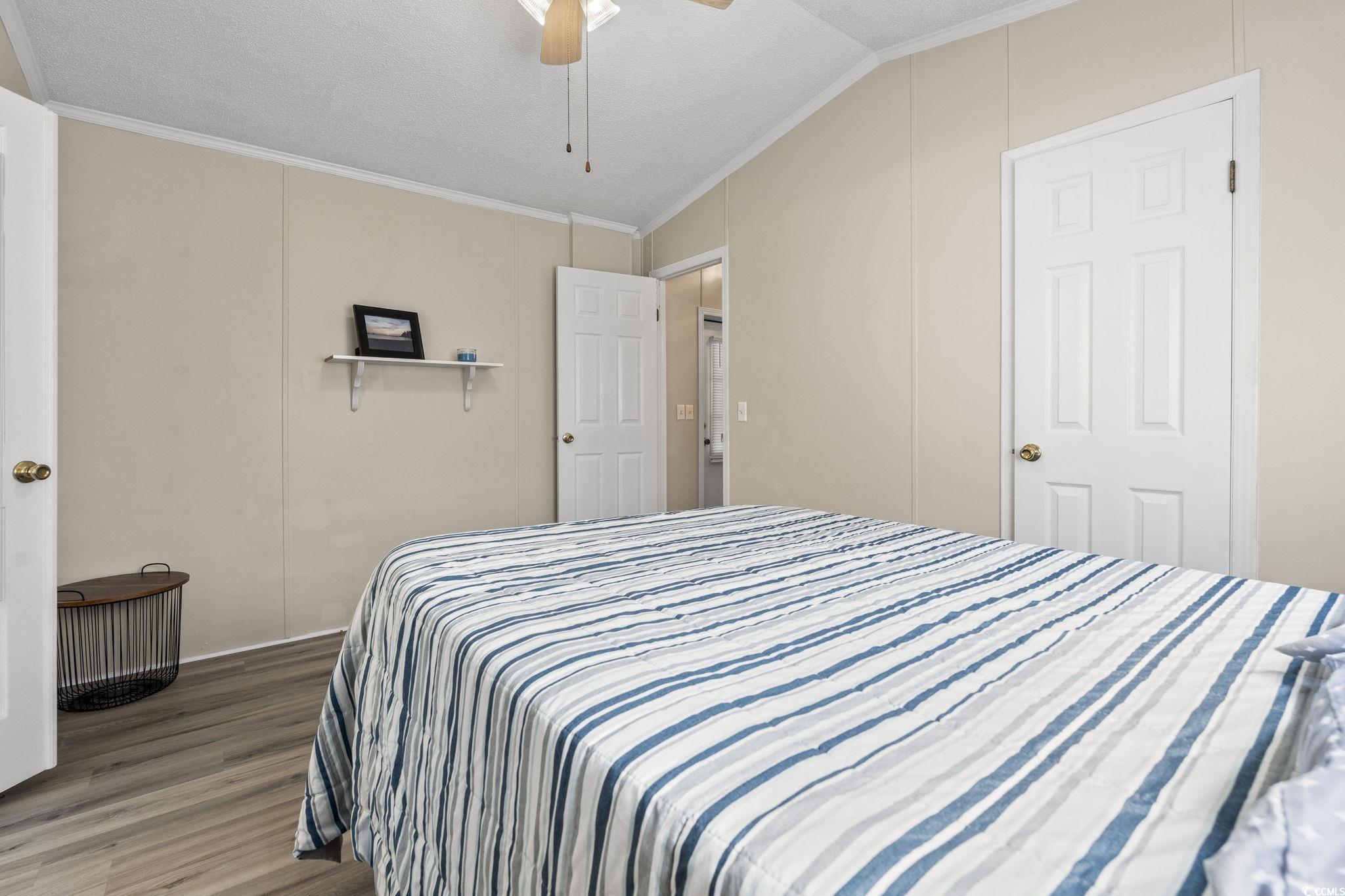 6350 Antioch Road Conway, SC 29527 - Photo 13 of 23 Bedroom featuring vaulted ceiling, wood finished f