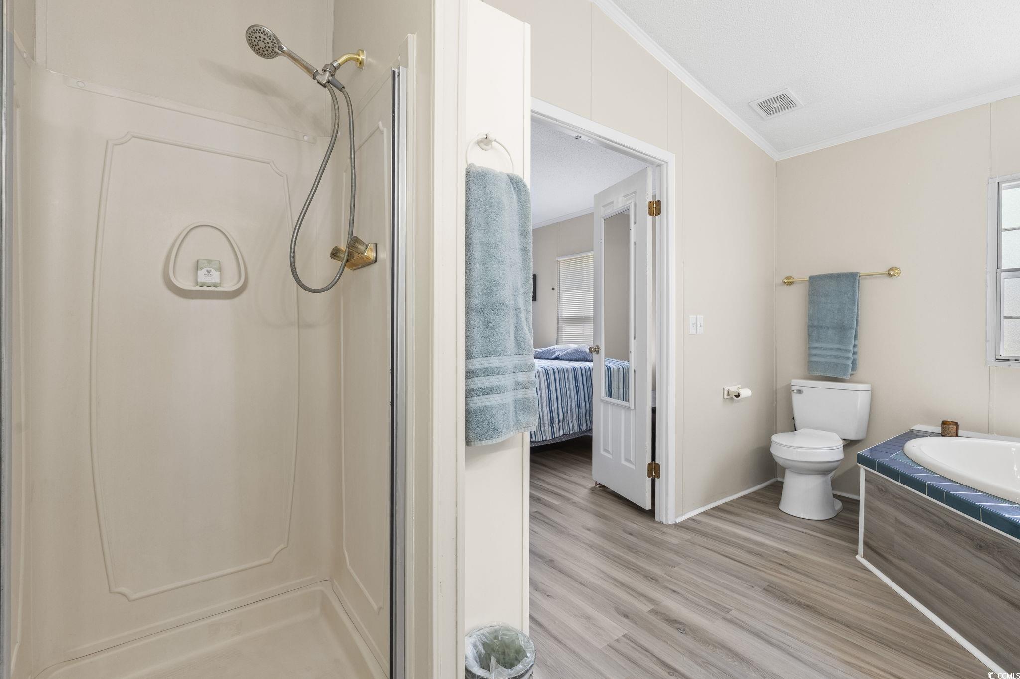 6350 Antioch Road Conway, SC 29527 - Photo 17 of 23 Ensuite bathroom featuring a stall shower, toilet,