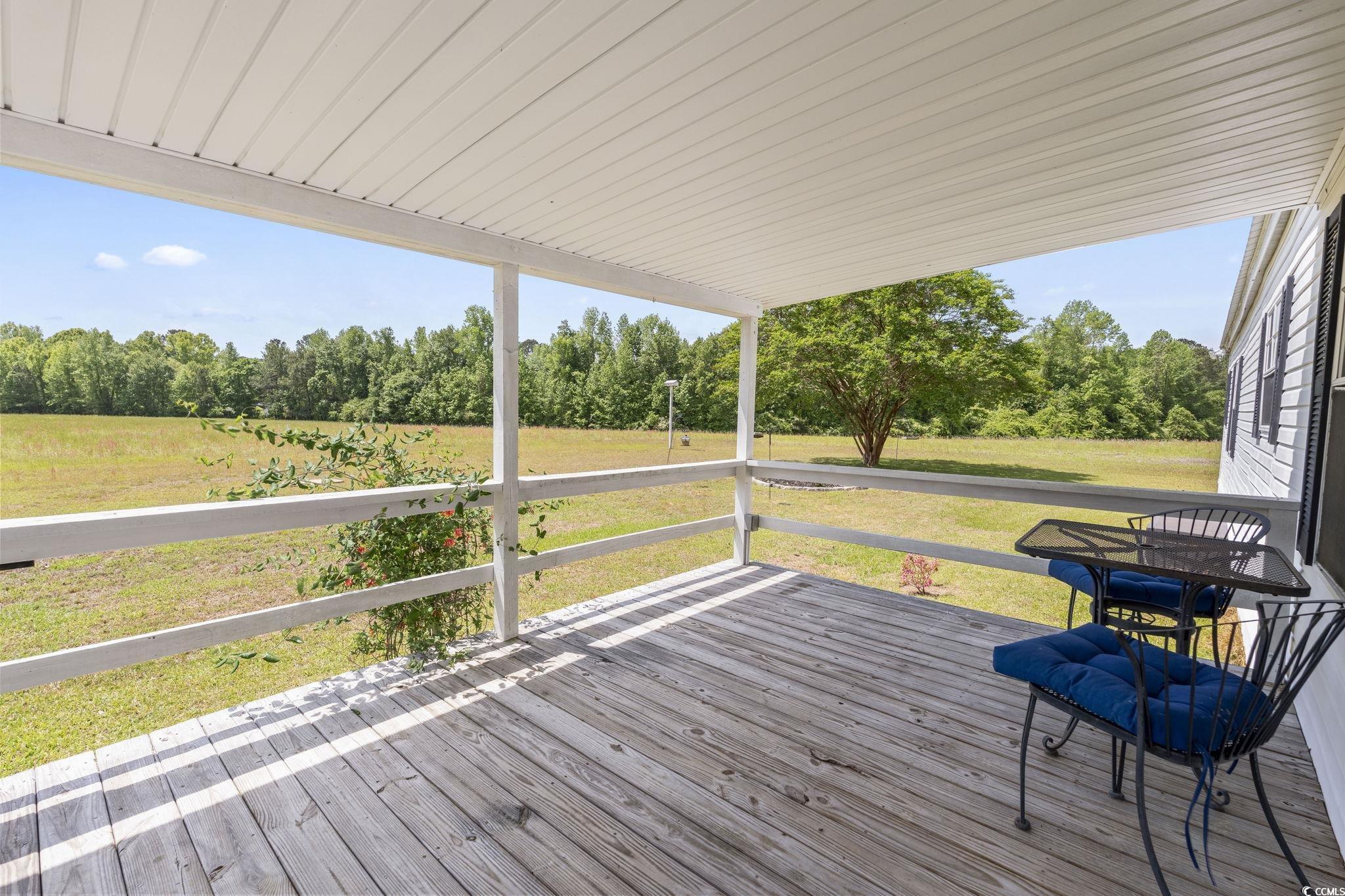 6350 Antioch Road Conway, SC 29527 - Photo 4 of 23 Wooden deck featuring a lawn and a rural view