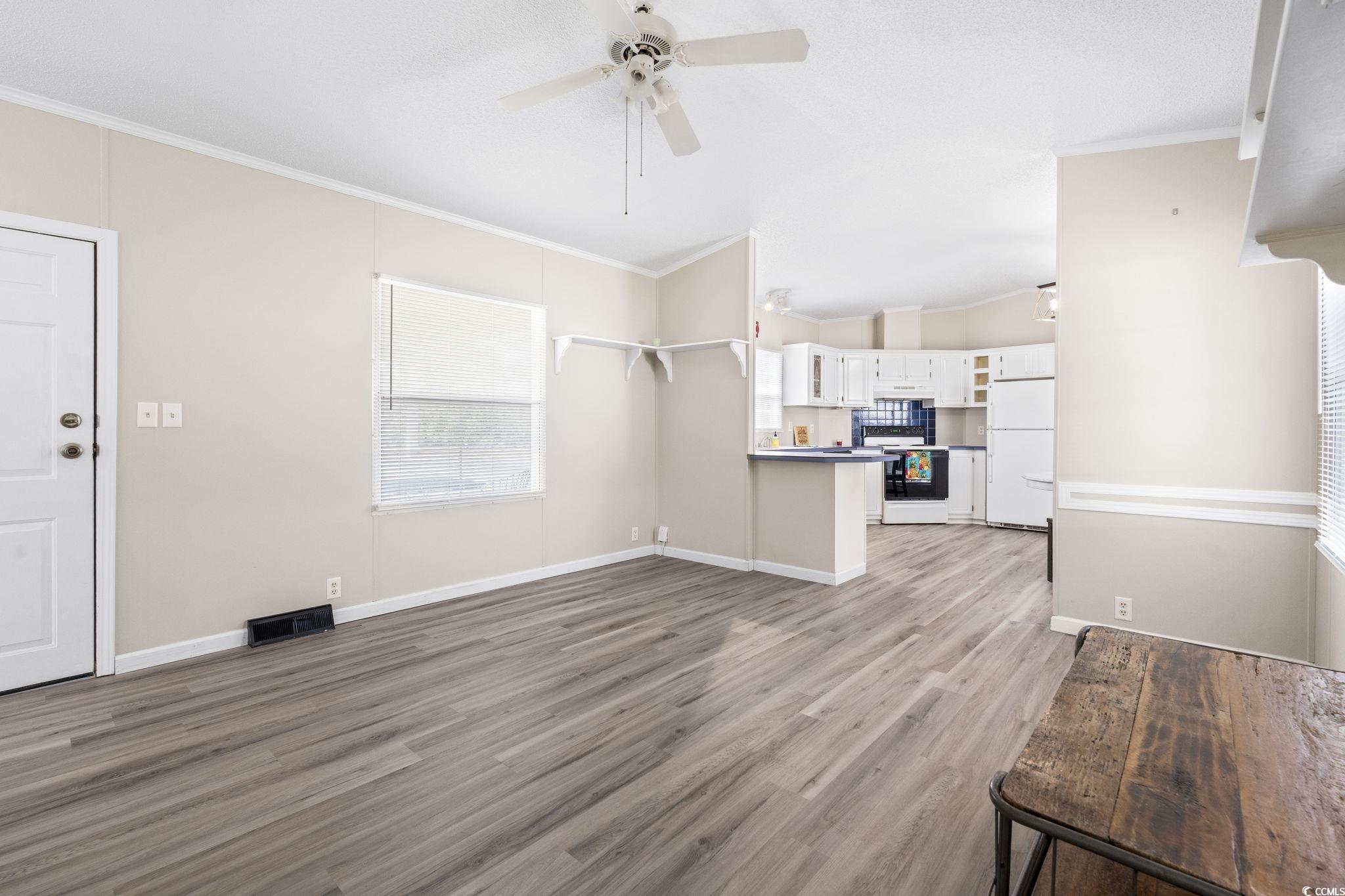 6350 Antioch Road Conway, SC 29527 - Photo 7 of 23 Unfurnished living room featuring light wood finis