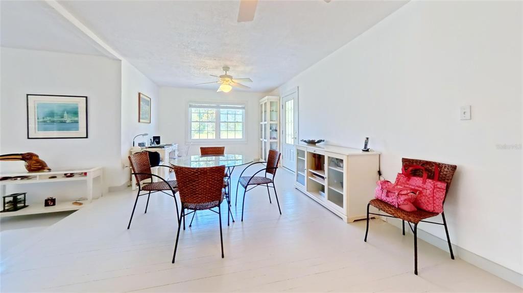 7390 South Mc Alpin Road McAlpin, FL 32062 - Photo 2 of 53 a view of a livingroom with furniture window and wooden floor