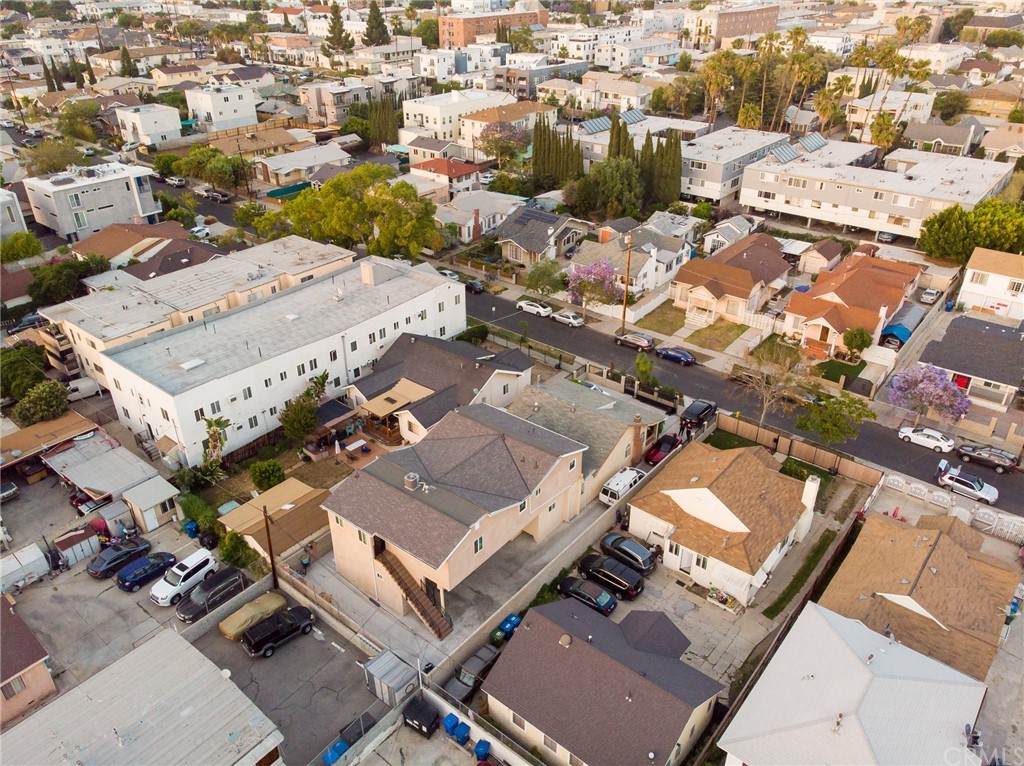 an aerial view of a residential building with parking