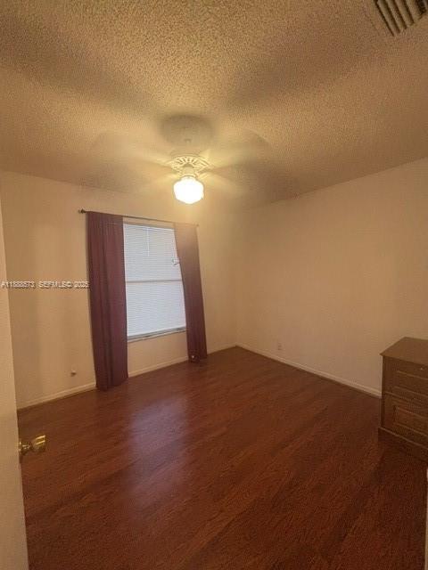 12149 Quilting Lane Boca Raton, FL 33428 - Photo 22 of 36 a view of an empty room and wooden floor