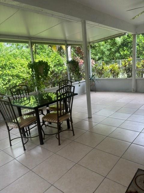 12149 Quilting Lane Boca Raton, FL 33428 - Photo 24 of 36 a view of a patio with dining table and chairs
