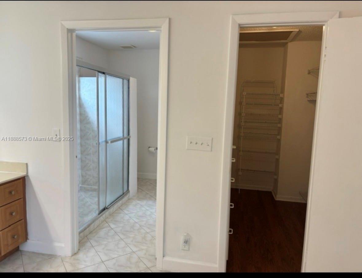 12149 Quilting Lane Boca Raton, FL 33428 - Photo 29 of 36 a view of a bathroom from a hallway