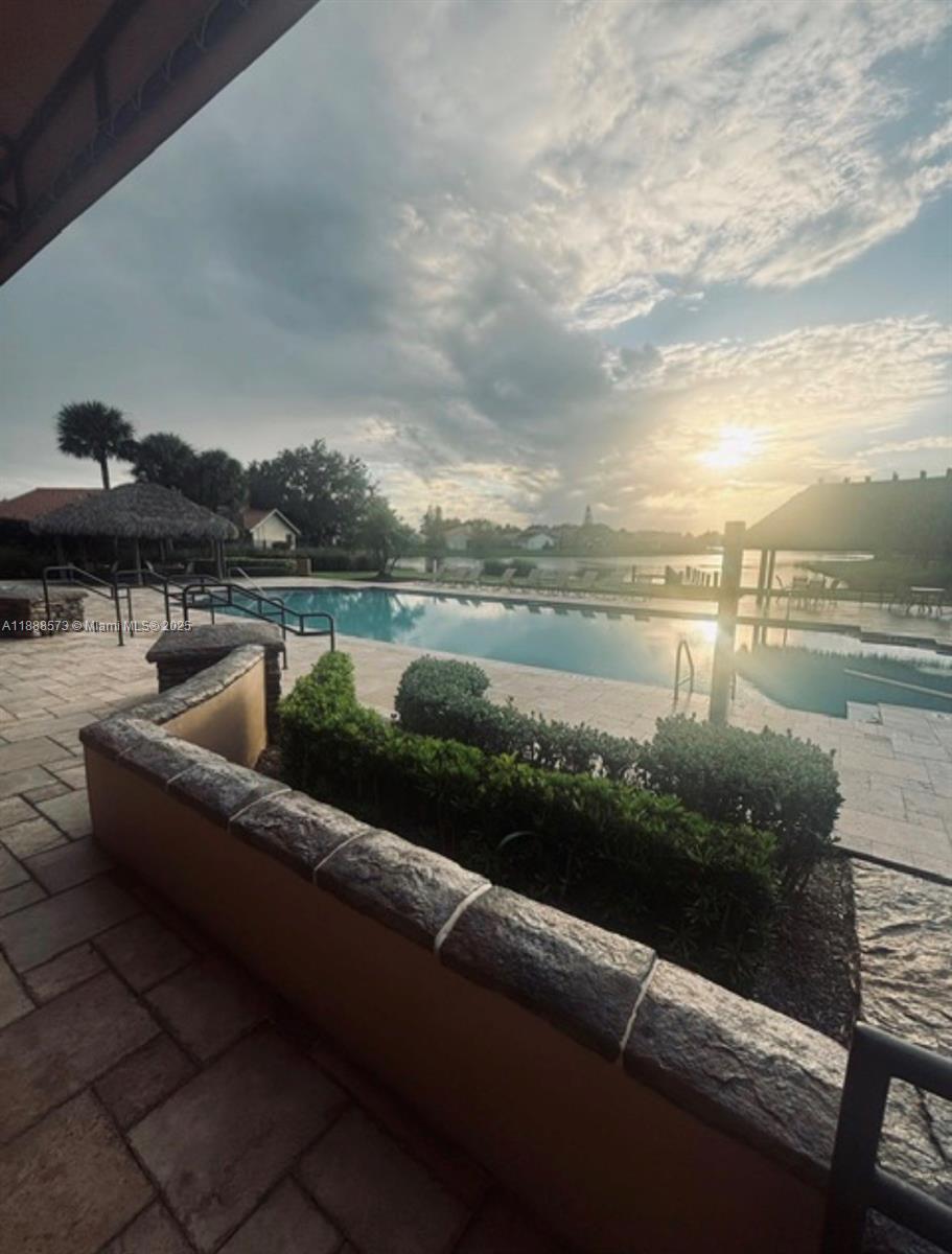 12149 Quilting Lane Boca Raton, FL 33428 - Photo 31 of 36 a view of a lake with couches and city view
