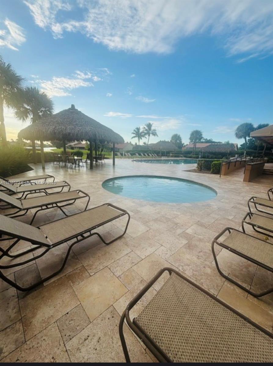 12149 Quilting Lane Boca Raton, FL 33428 - Photo 33 of 36 a view of a swimming pool and lake view