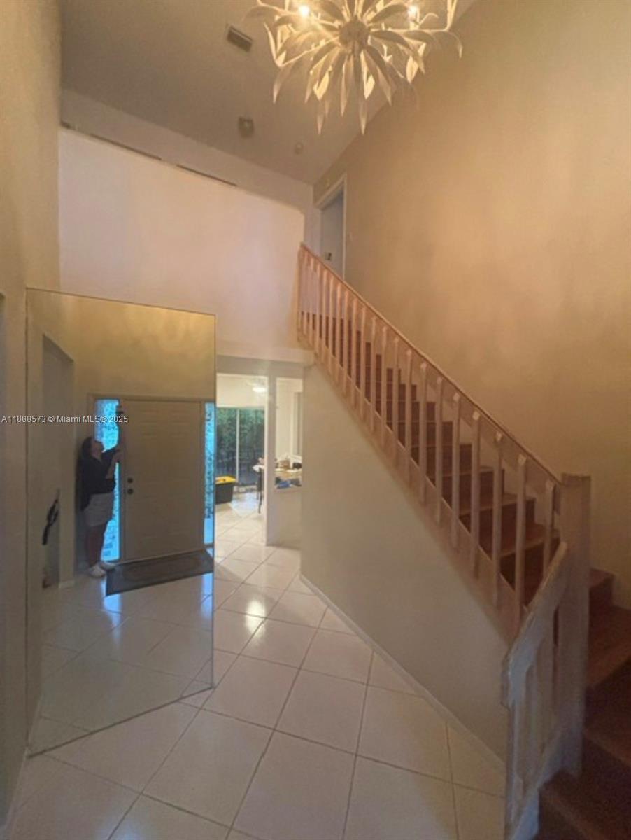 12149 Quilting Lane Boca Raton, FL 33428 - Photo 5 of 36 a view of entryway and hall with a window