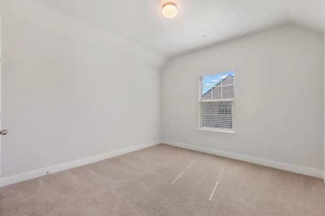 an empty room with a empty space and window