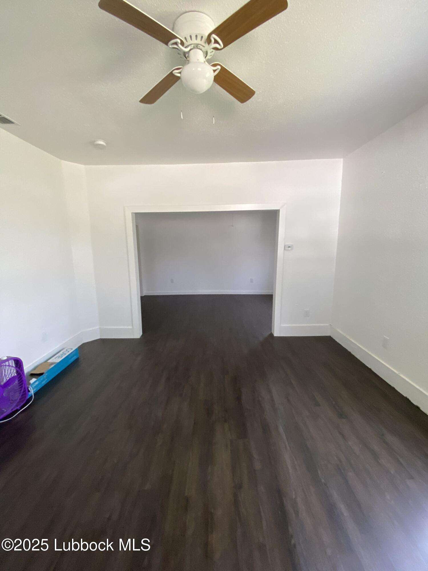 225 South 11th Street Slaton, TX 79364 - Photo 7 of 20 Living-Room-Looking-West-From-Front-Door