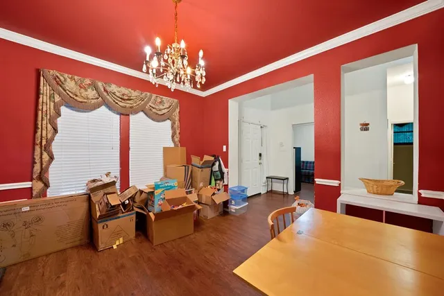 a living room with furniture chandelier and a chandelier
