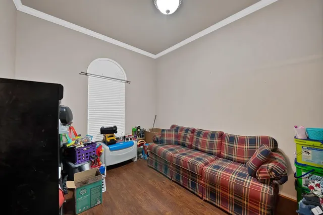 a living room with furniture fireplace and a window