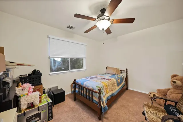 a bedroom with a bed furniture and a window