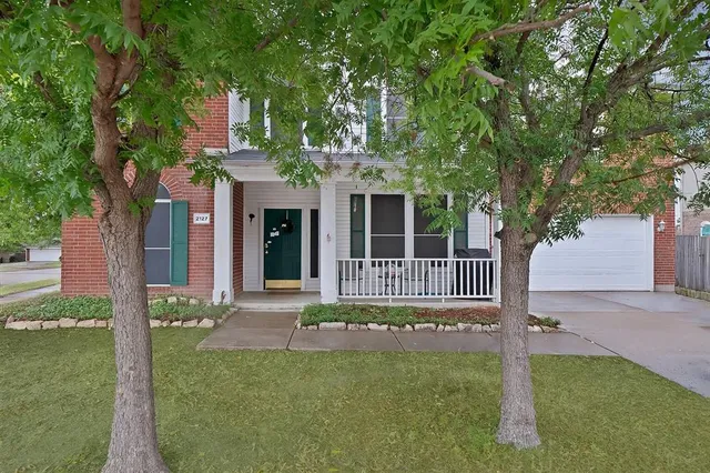 a view of a house with a garden