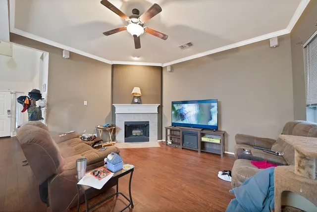 a living room with furniture fireplace and a flat screen tv