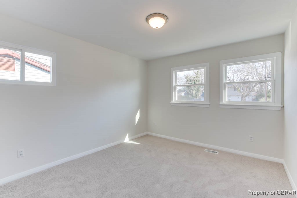 3310 West Weaver Road Hampton, VA 23666 - Photo 20 of 28 an empty room with windows