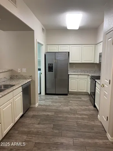 a kitchen with a stove and a microwave