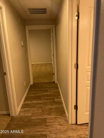 a bathroom with a granite countertop sink a toilet and a mirror