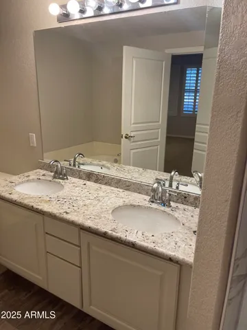 a bathroom with a shower and toilet