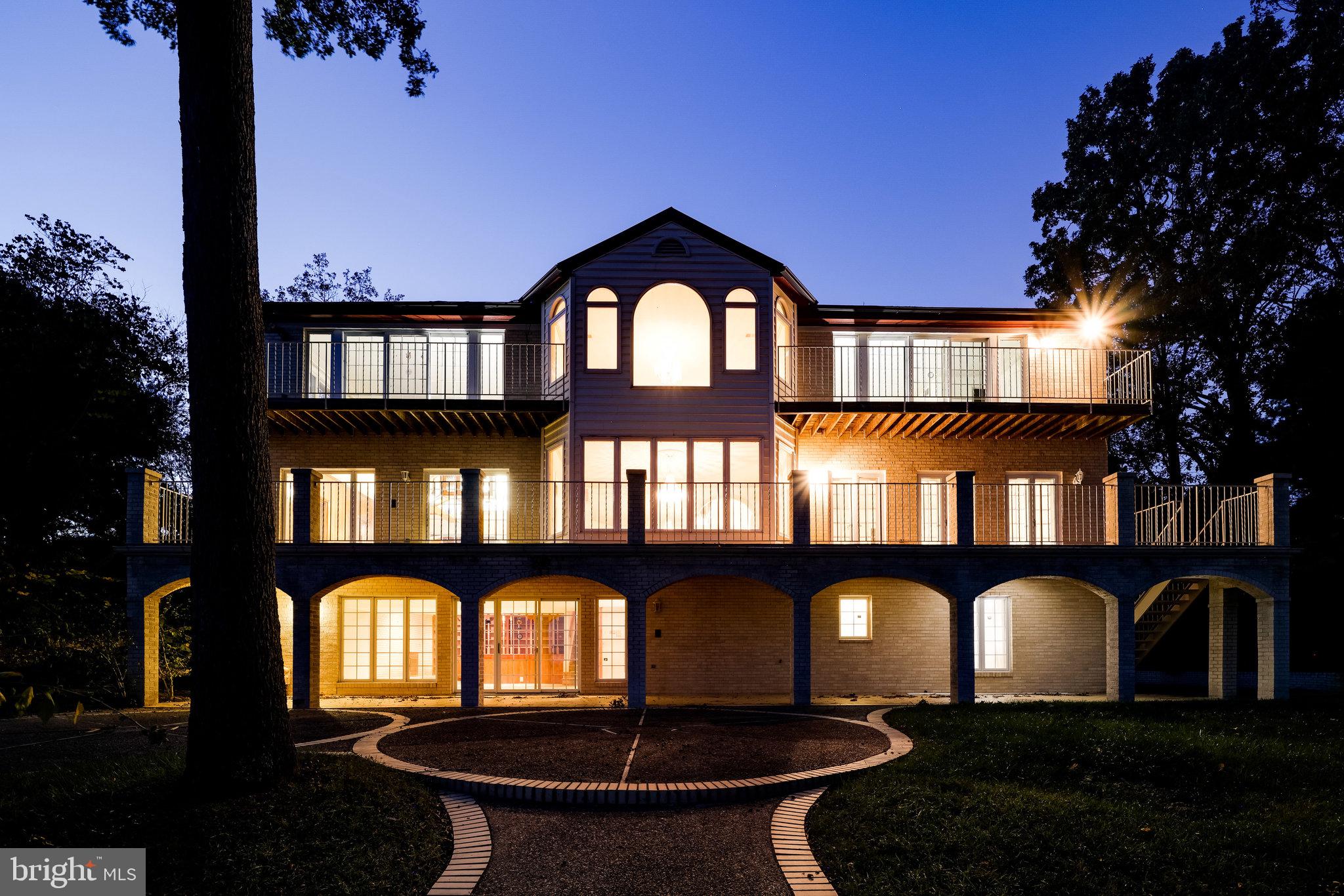 3901 Belle Rive Terrace Alexandria, VA 22309 - Photo 3 of 16 a front view of house with yard and outdoor seating