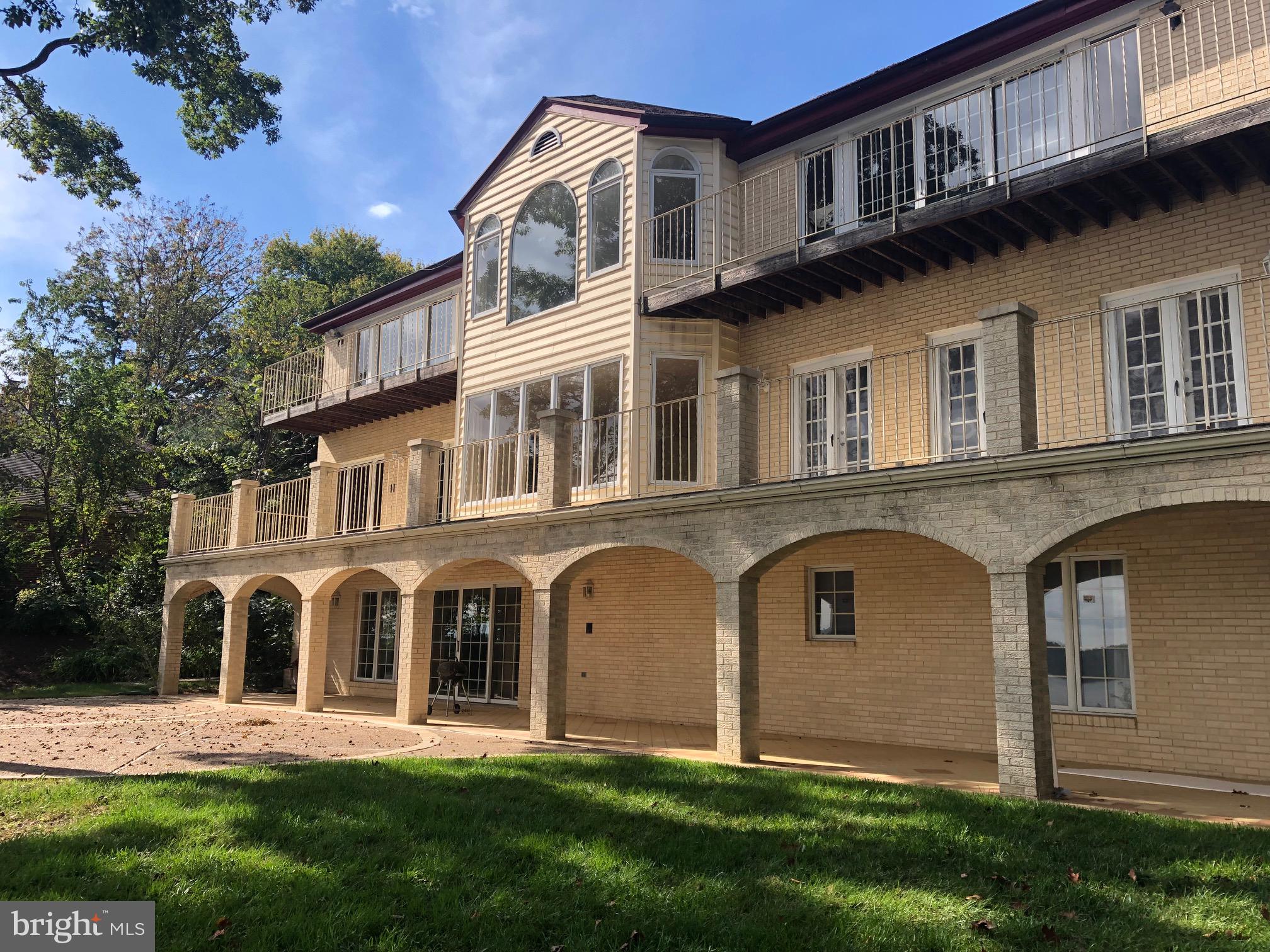 3901 Belle Rive Terrace Alexandria, VA 22309 - Photo 6 of 16 a front view of a house with a yard