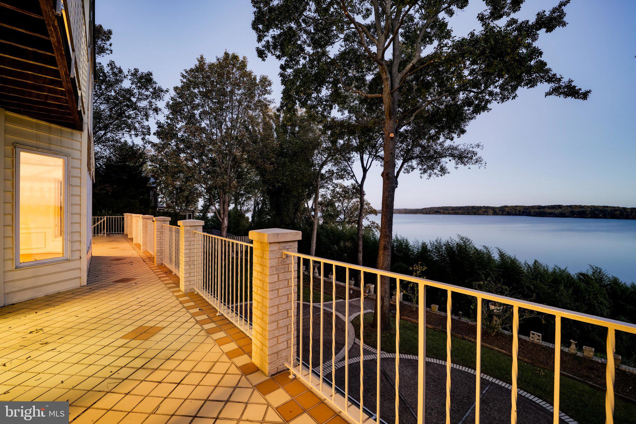 3901 Belle Rive Terrace Alexandria, VA 22309 - Photo 8 of 16 a view of balcony with wooden floor and lake view