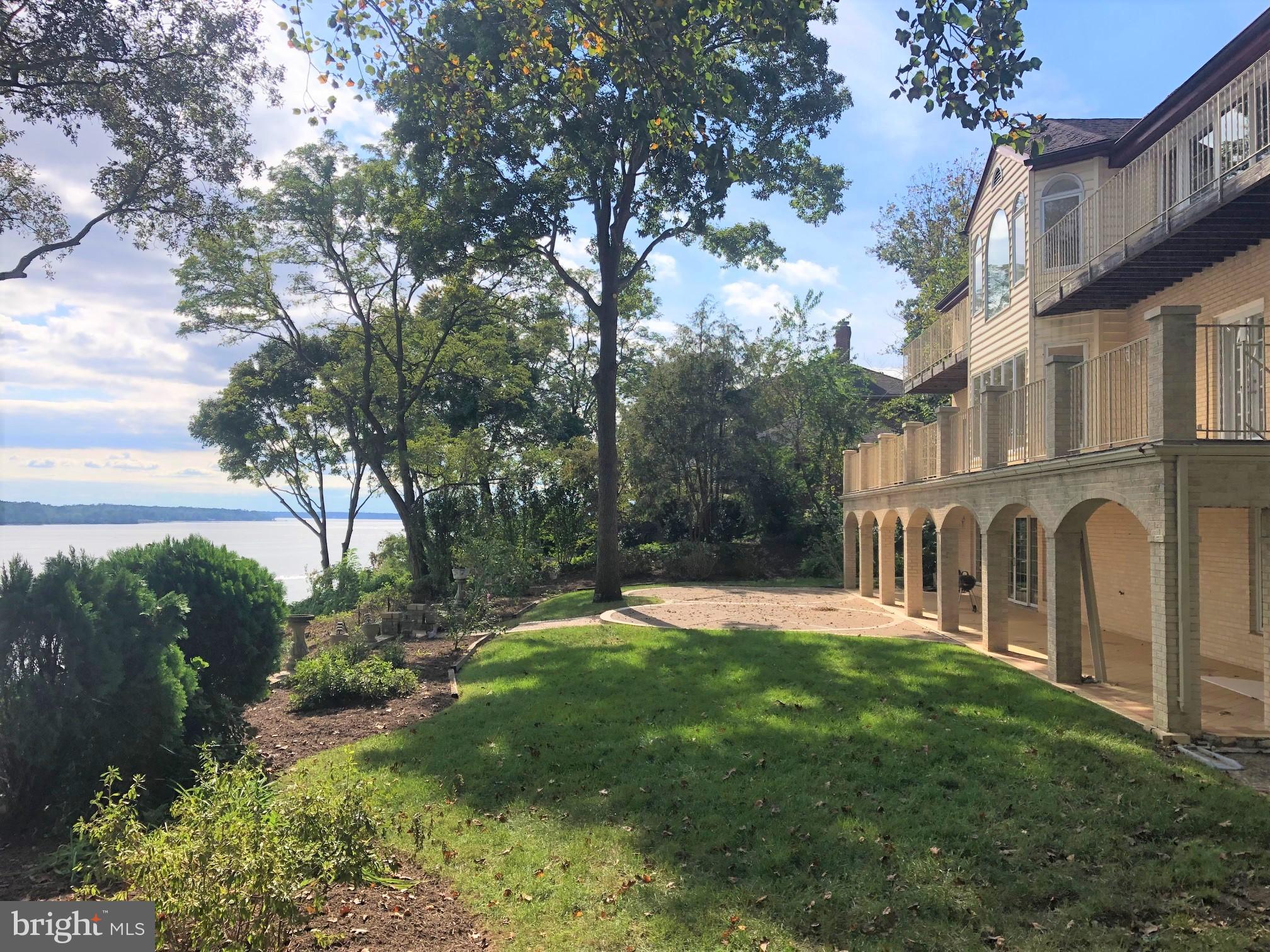 3901 Belle Rive Terrace Alexandria, VA 22309 - Photo 10 of 16 a backyard of a house with lots of green space