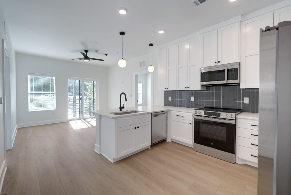 3000 Duval Street, Unit 305 Austin, TX 78705 - Photo 1 of 1 a kitchen with stainless steel appliances granite countertop a stove a sink and a refrigerator