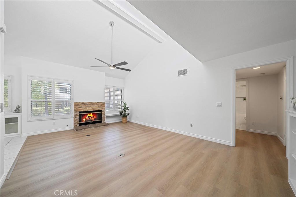 4277-1 Las Virgenes Road Calabasas, CA 91302 - Photo 1 of 28 Open spacious living room with a cozy fireplace and vaulted ceilings.