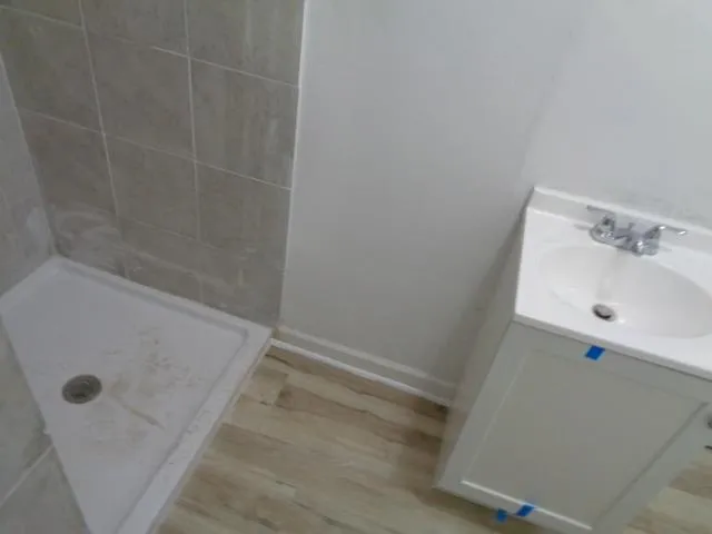 a bathroom with a sink toilet and a mirror