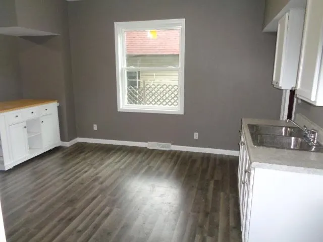 a view of a kitchen with a sink
