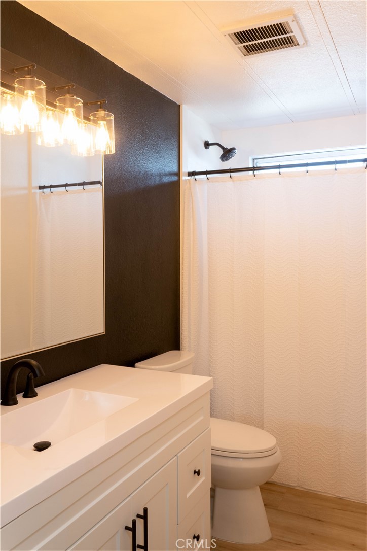 8723 Artesia Boulevard, Unit 7 Bellflower, CA 90706 - Photo 7 of 10 a bathroom with a sink and a mirror