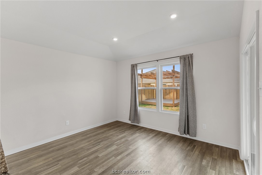 6018 Crest Bridge Bryan, TX 77807 - Photo 12 of 30 an empty room with wooden floor and windows