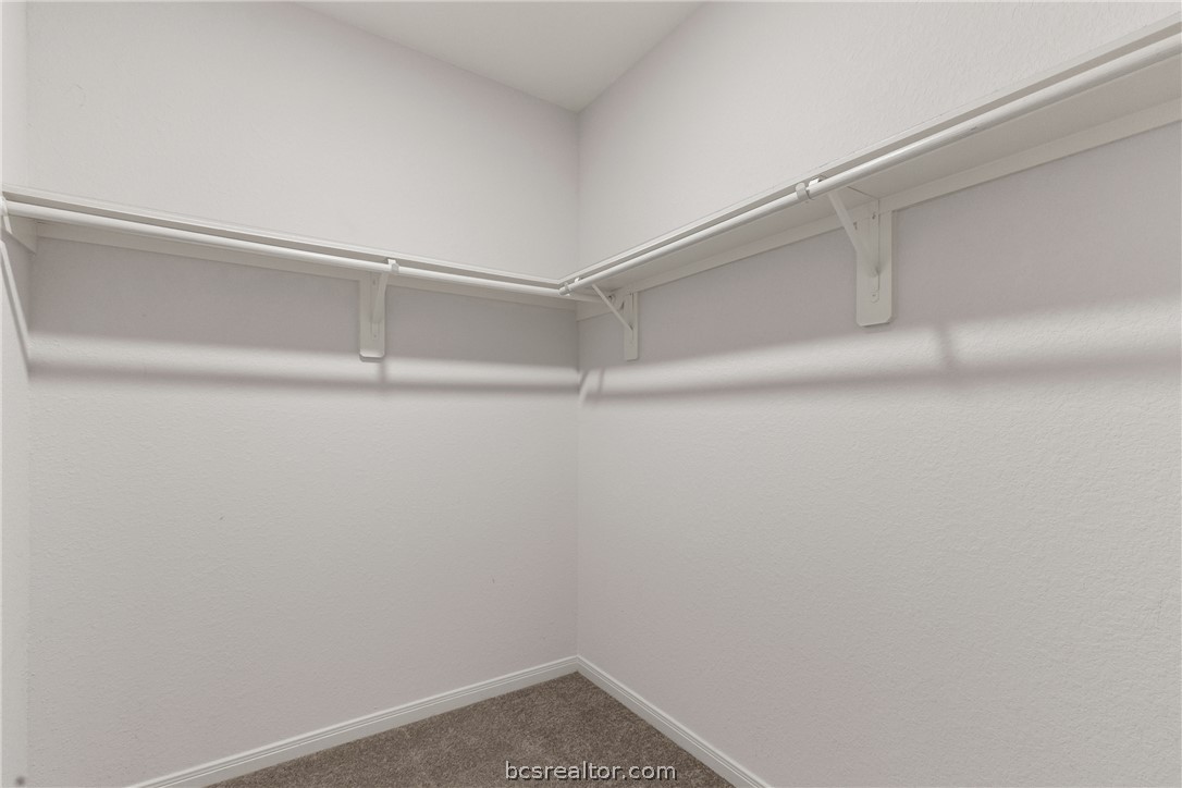 6018 Crest Bridge Bryan, TX 77807 - Photo 19 of 30 a view of an empty walk in closet