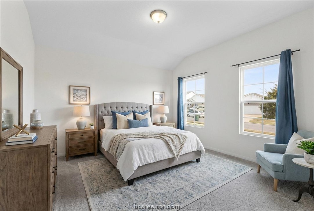 6018 Crest Bridge Bryan, TX 77807 - Photo 20 of 30 a bedroom with a bed and a couch