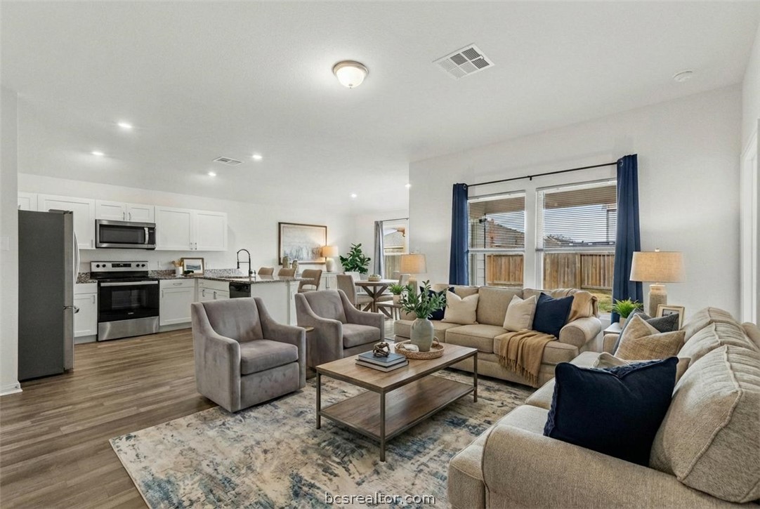 6018 Crest Bridge Bryan, TX 77807 - Photo 2 of 30 a living room with furniture kitchen view and a large window