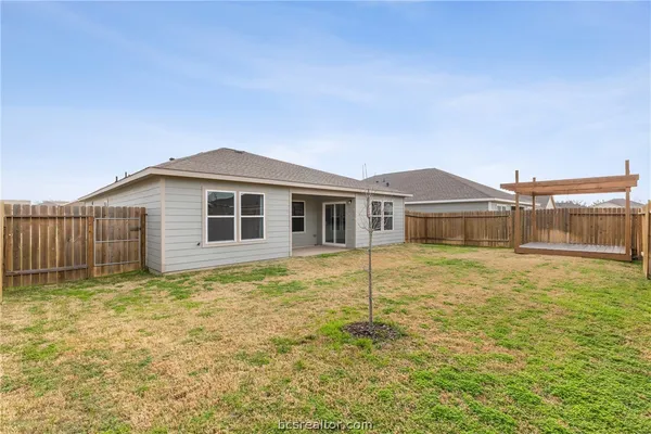 a house with trees in the background